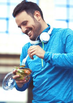 Man is eating vegetable salad